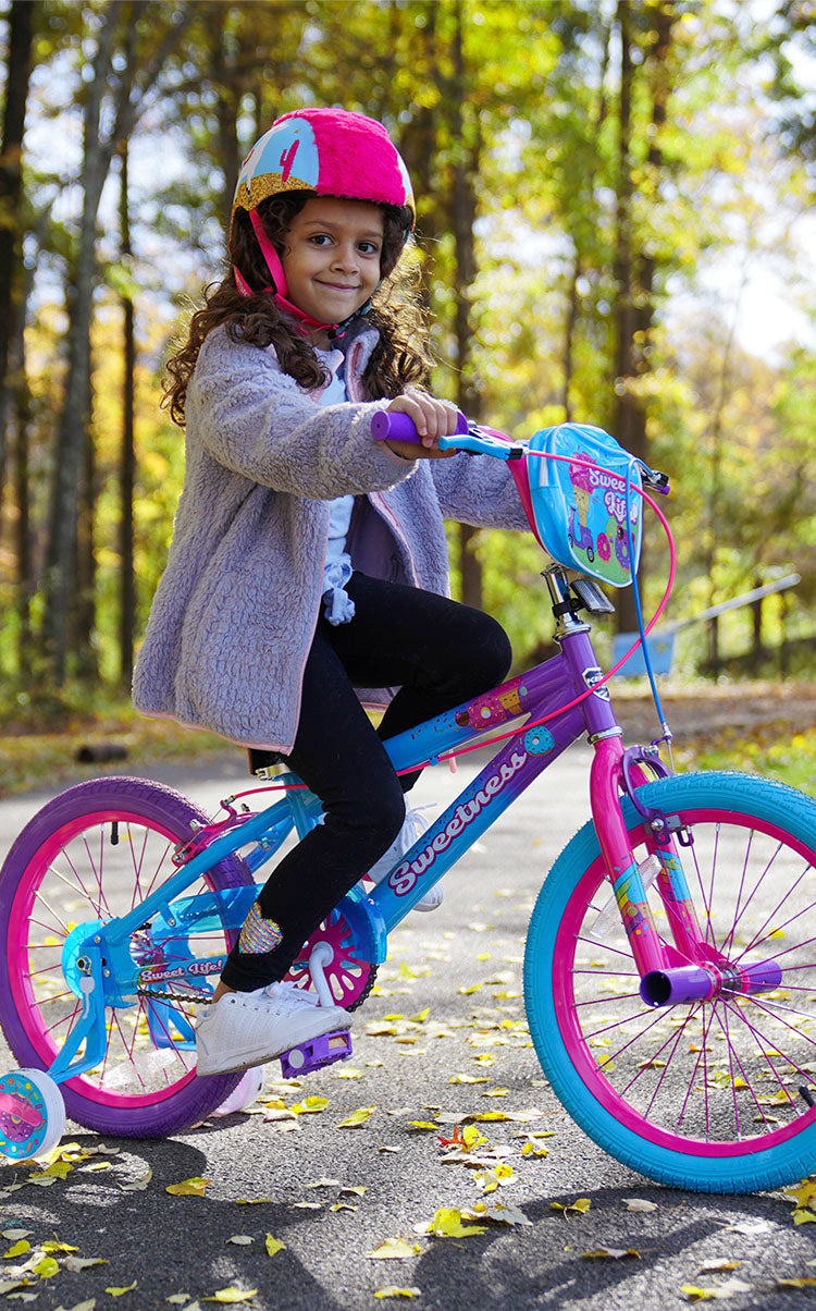Little girl riding a 18" girl's Kent sweetness bike